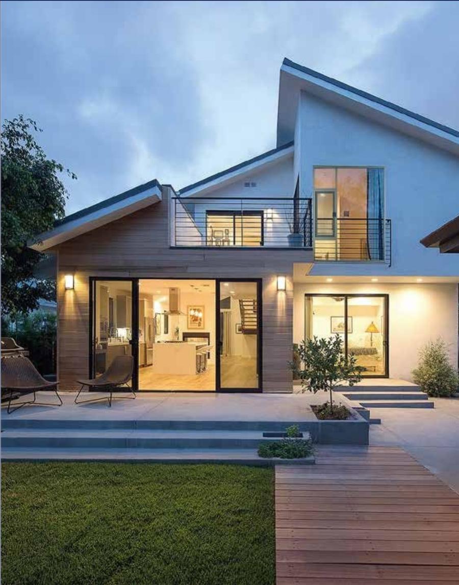 Modern house at dusk with black aluminium sliding doors